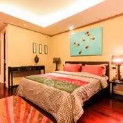 Luxurious bedroom with modern decor and ambient lighting