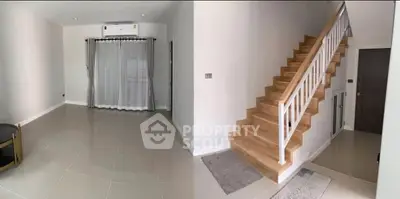 Modern interior with sleek staircase and spacious living area