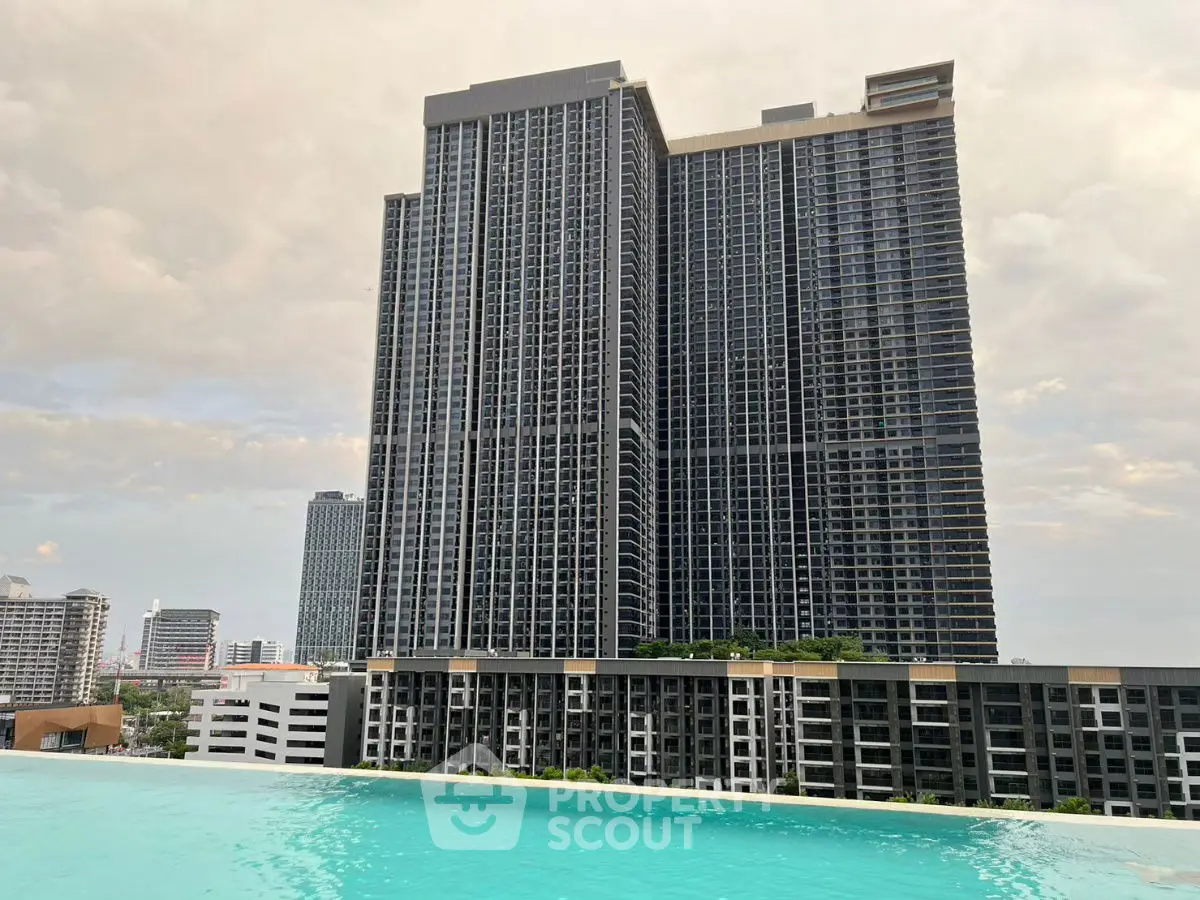 Stunning high-rise building with infinity pool and city skyline view