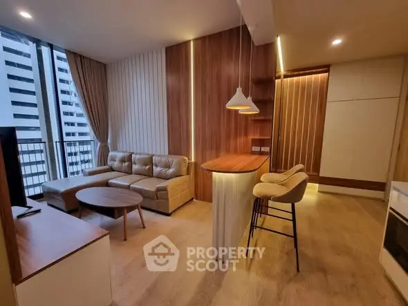 Modern living room with stylish decor and city view from balcony