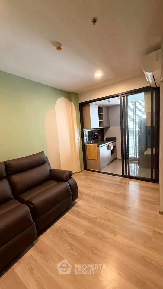 Modern living room with sleek design and open kitchen layout