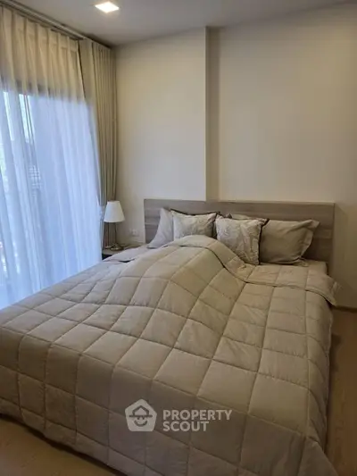 Cozy bedroom with modern decor and natural light