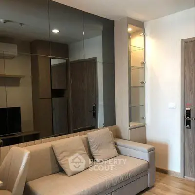 Modern living room with stylish sofa and mirrored wall design