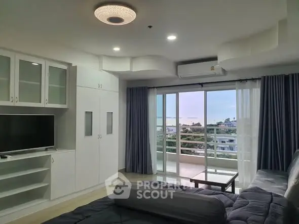 Spacious living room with modern decor and balcony view