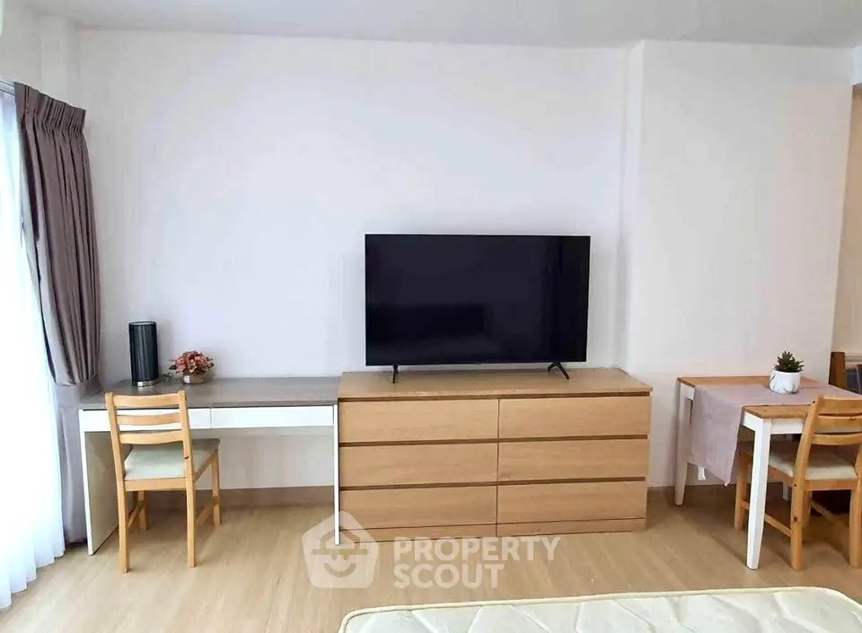 Modern living room with sleek TV setup and stylish furniture