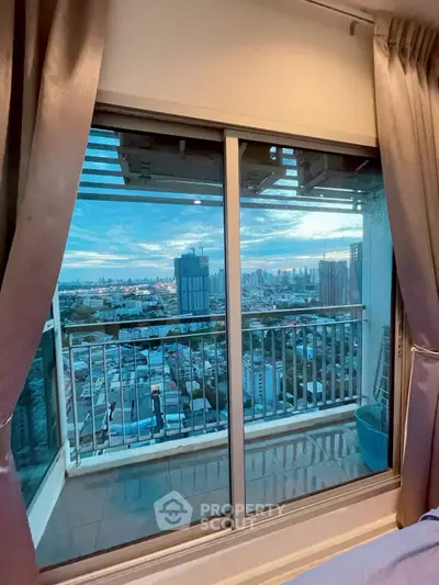 Stunning cityscape view from a modern high-rise balcony at sunset, perfect for urban living enthusiasts.