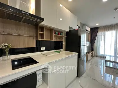 Modern kitchen with sleek appliances and open layout in stylish apartment