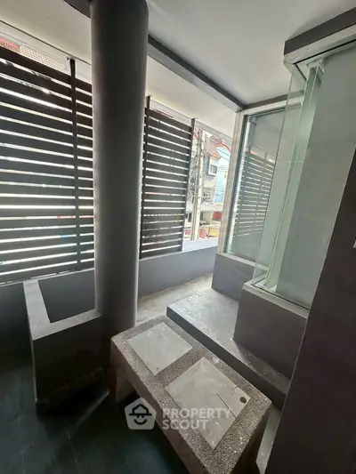 Modern balcony with sleek design and urban view