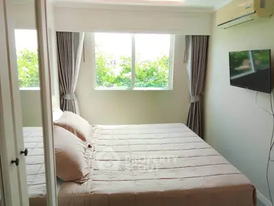 Cozy bedroom with large window and modern decor