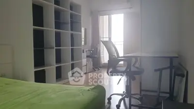Spacious bedroom with modern furniture and balcony access