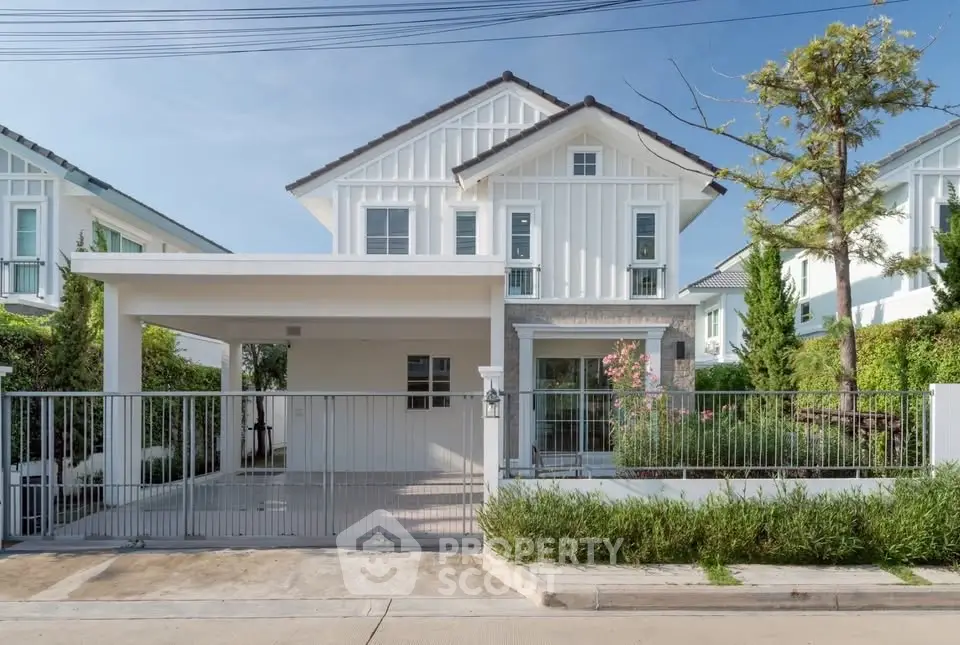 Charming two-story house with modern design and lush garden in a serene neighborhood.