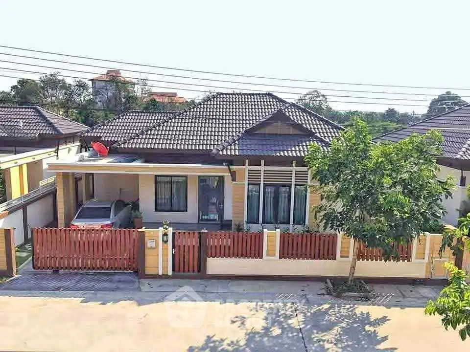 Charming single-story home with modern design and spacious driveway in a serene neighborhood.