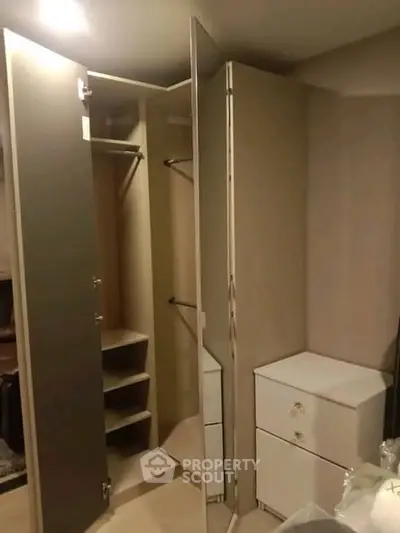 Spacious walk-in closet with ample storage and sleek design