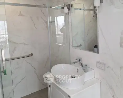 Modern bathroom with elegant marble tiles and sleek fixtures