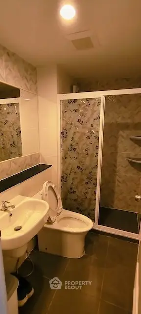 Modern bathroom with shower enclosure and stylish tile design