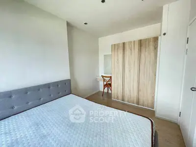 Spacious bedroom with modern design and ample natural light