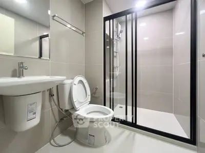 Modern bathroom with sleek shower enclosure and contemporary fixtures