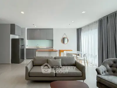Modern living room with open kitchen and stylish furniture