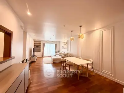 Spacious modern living room with elegant dining area and wooden flooring