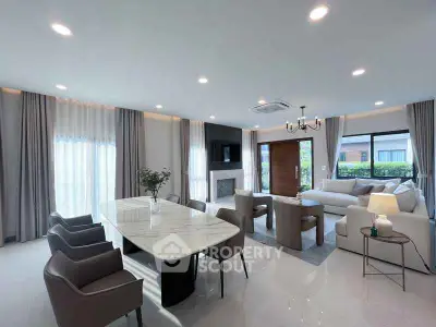 Spacious modern living room with elegant dining area and natural light