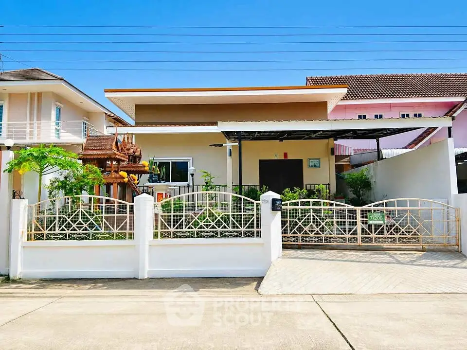 Charming single-story home with gated entrance and lush garden in a serene neighborhood.