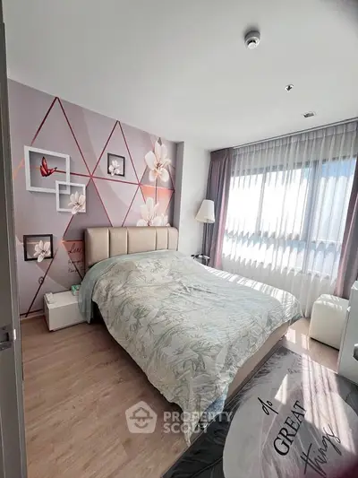 Chic bedroom with floral accent wall and ample natural light