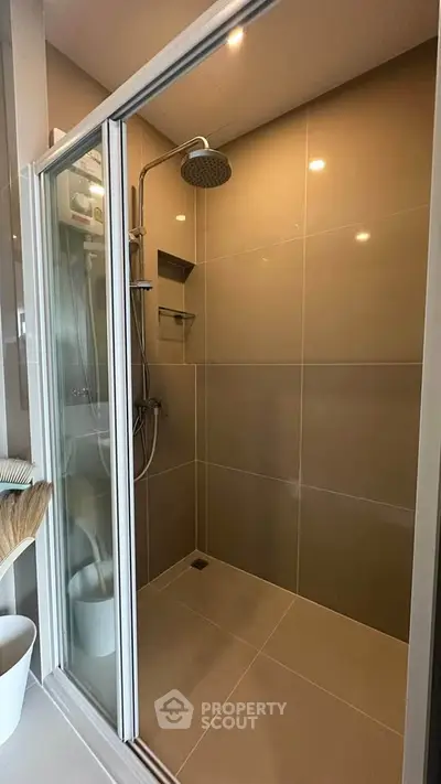 Modern bathroom with sleek shower enclosure and contemporary fixtures