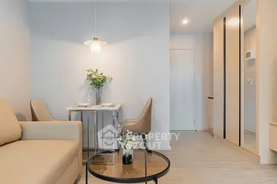 Modern living room with cozy seating and elegant dining area