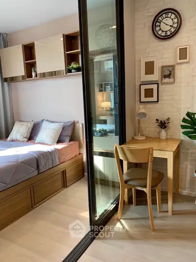 Cozy bedroom with study area and modern decor in stylish apartment