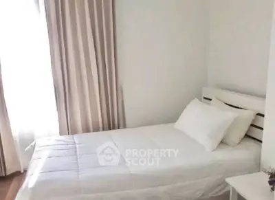 Cozy minimalist bedroom with natural light and simple decor