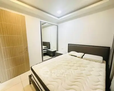 Modern bedroom with minimalist design and large mirror closet