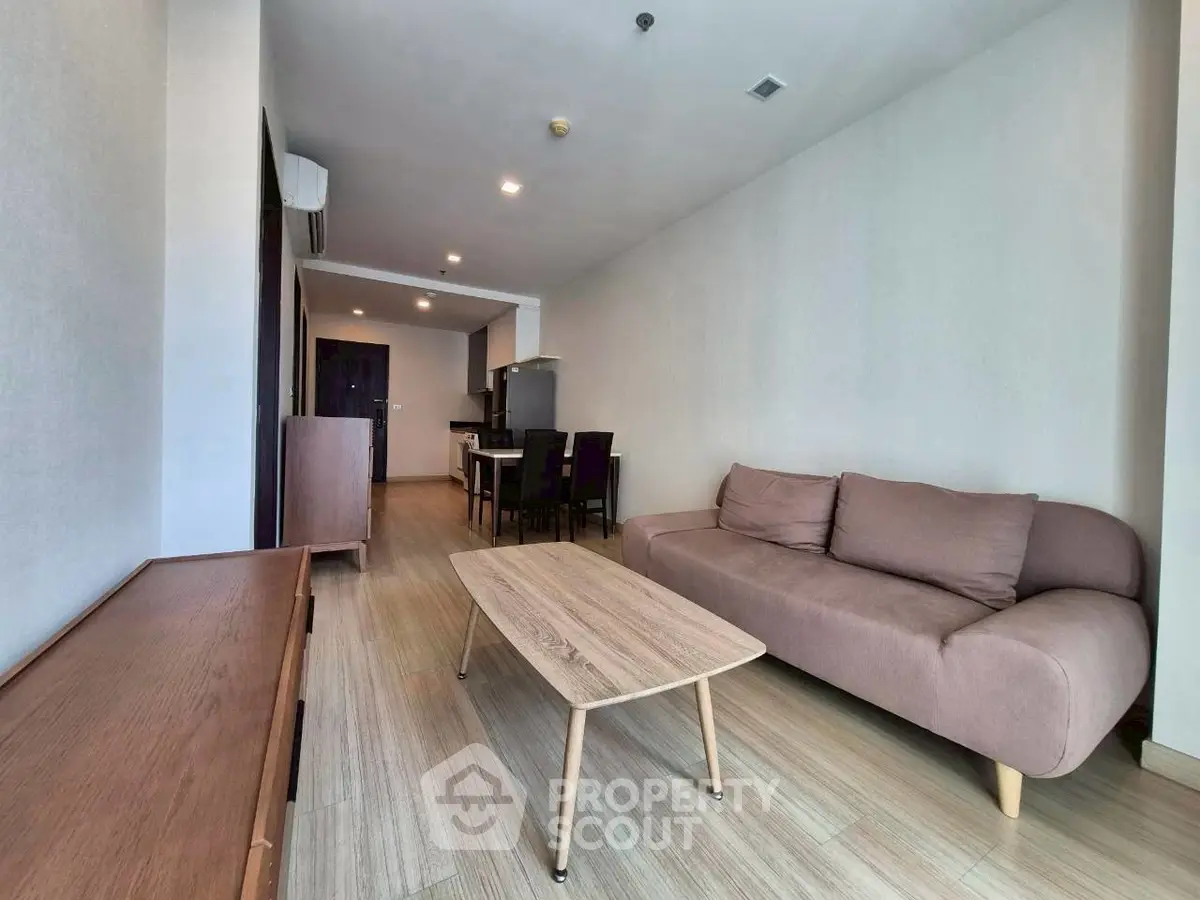 Spacious modern living room with sleek furniture and open layout