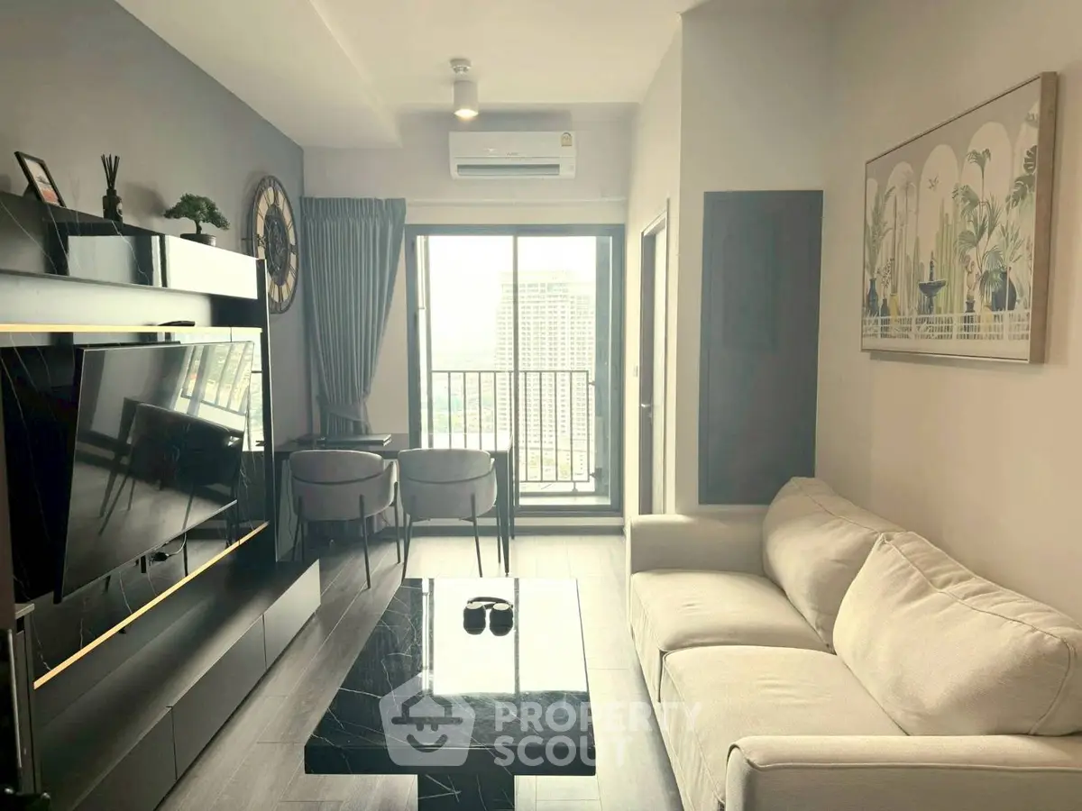 Modern living room with sleek furniture and city view balcony