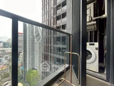 Modern high-rise balcony with city view and washing machine