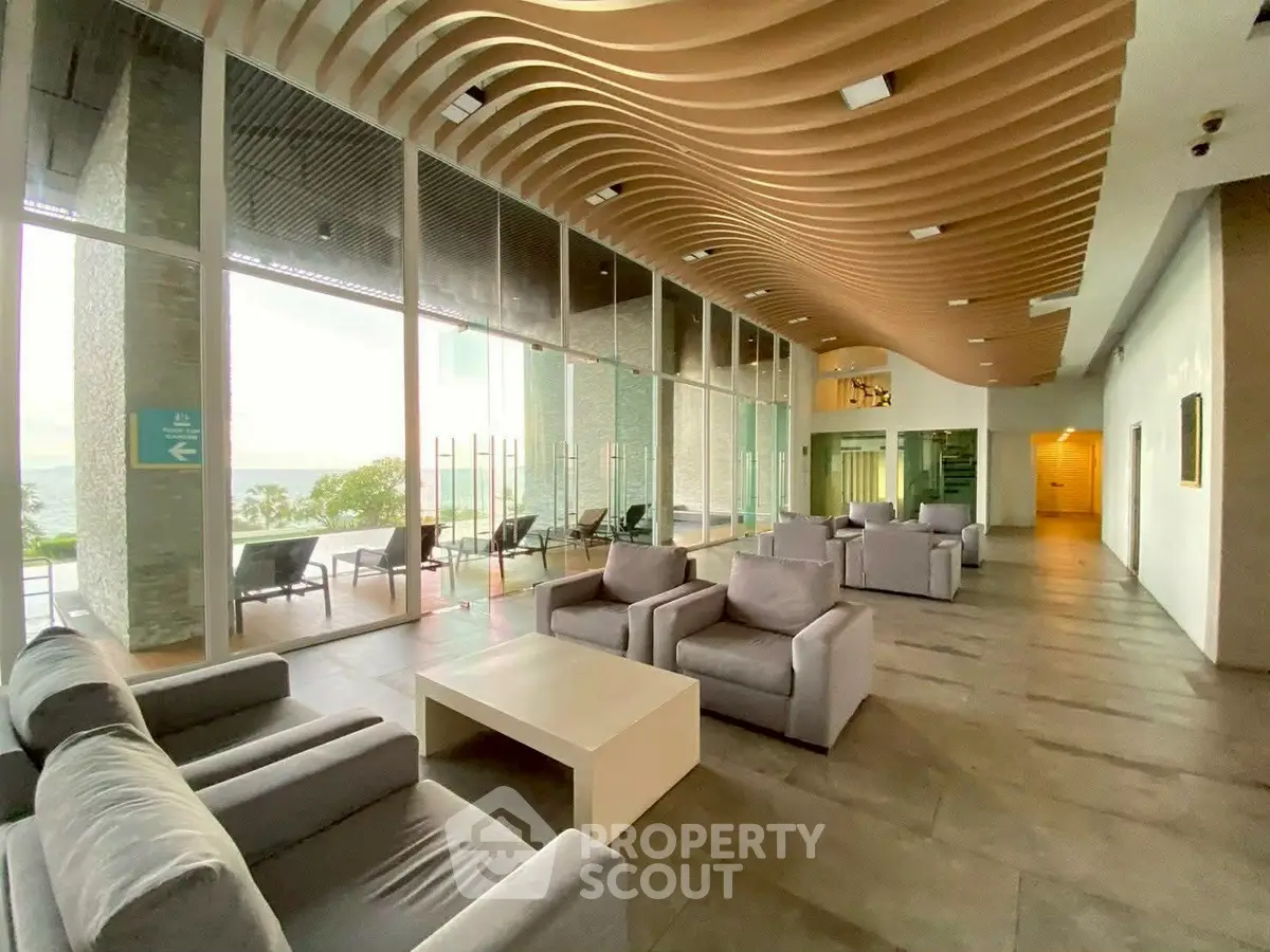 Luxurious modern lobby with ocean view and stylish seating area