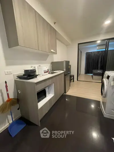 Modern kitchen with sleek cabinets and appliances in a stylish apartment