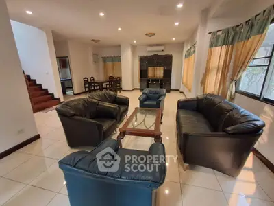 Spacious living room with leather sofas and elegant decor