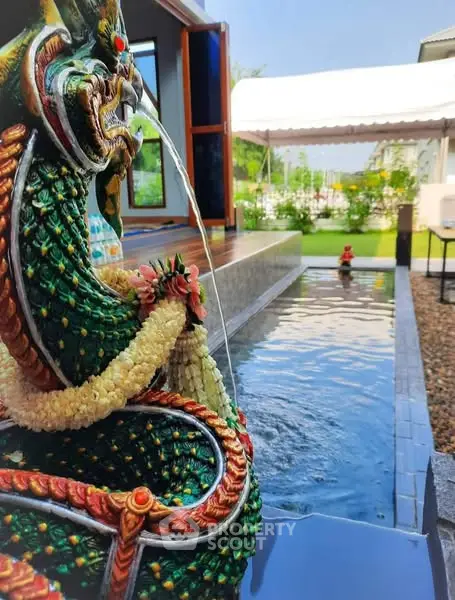 Stunning garden with decorative water feature and lush greenery