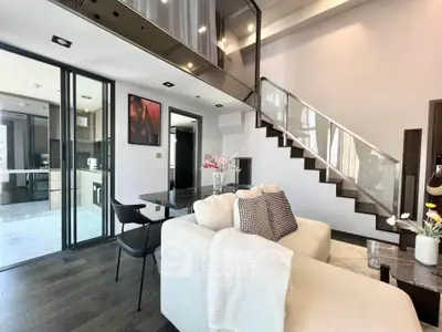 Modern duplex living room with stylish staircase and open kitchen layout