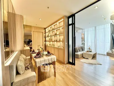 Luxurious open-plan living and dining area with elegant decor and natural light.
