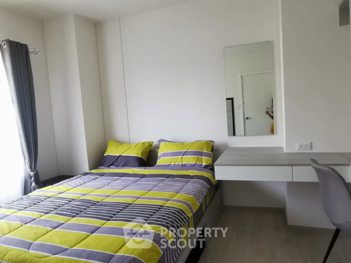 Modern bedroom with stylish bedding and sleek furniture design