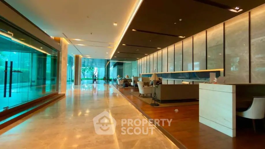 Luxurious modern lobby with elegant marble flooring and stylish seating area.
