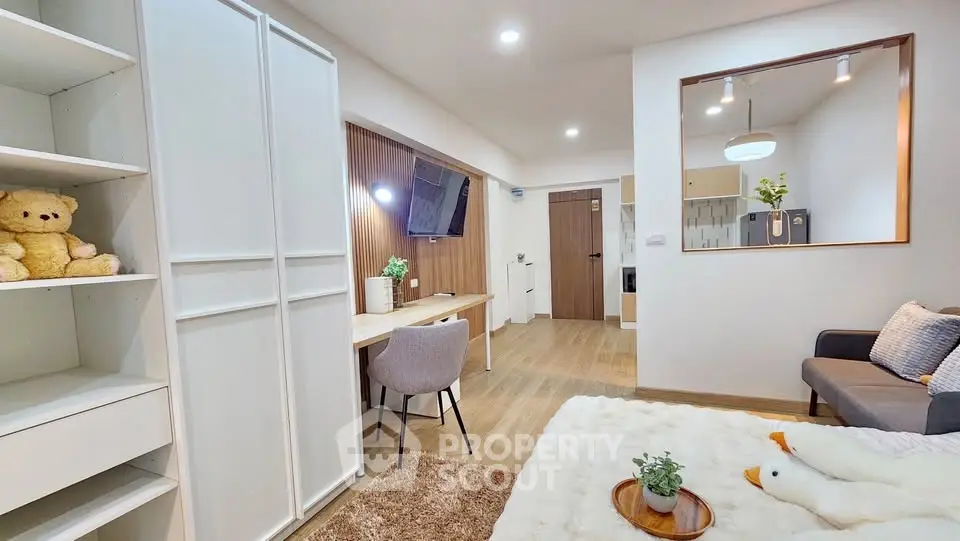 Modern cozy living room with study area and open kitchen layout