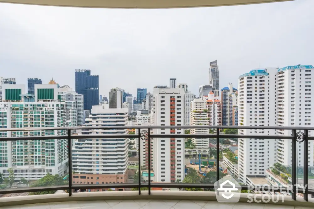 Stunning cityscape view from a high-rise balcony in a modern urban setting.