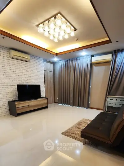 Spacious modern living room with elegant lighting and stylish decor