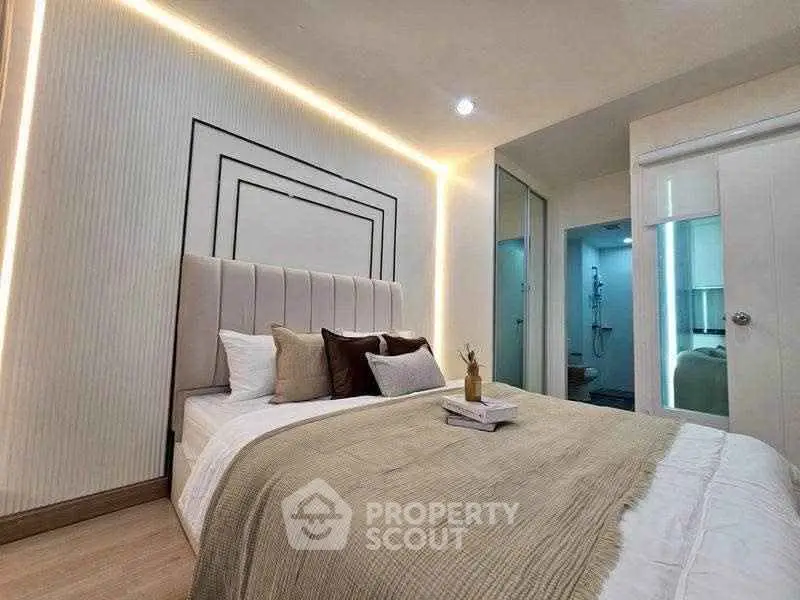 Modern bedroom with elegant lighting and stylish decor