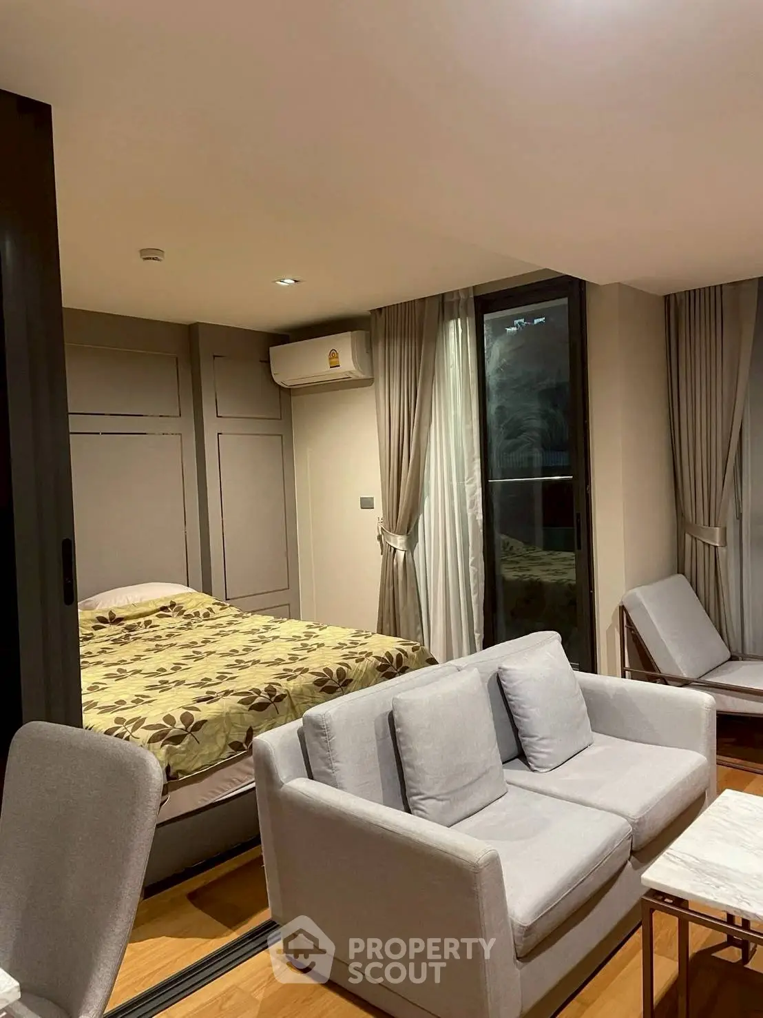 Cozy modern living room with integrated bedroom and stylish furniture