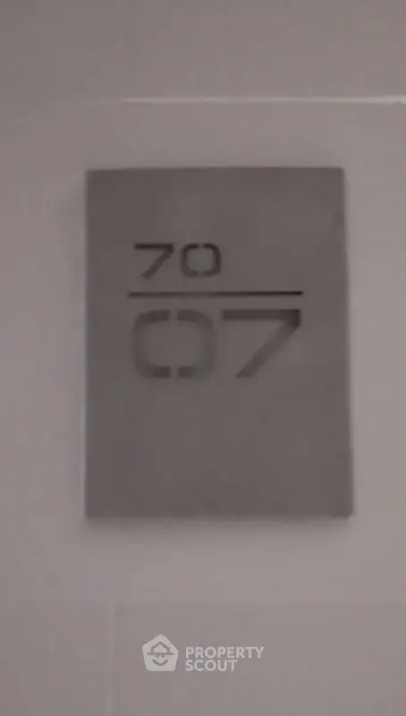 Modern apartment number sign with sleek design