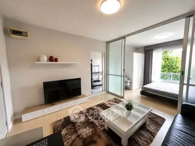 Modern living room with open layout and bedroom view