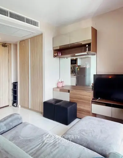 Modern living room with sleek furniture and stylish decor in a cozy apartment.